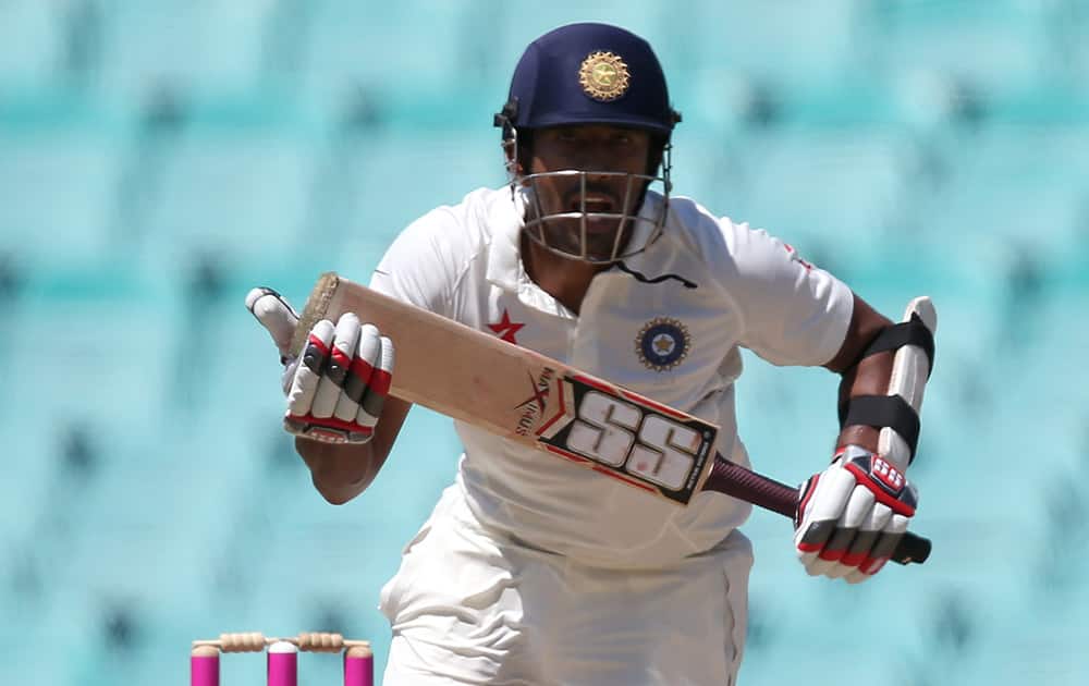 Wriddhiman Saha makes runs against Australia on the fourth day of their cricket test match in Sydney.