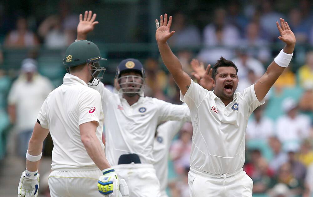 Suresh Raina, appeals to the umpire for a LBW decision on Australia's Chris Rogers on the fourth day of their cricket test match in Sydney.