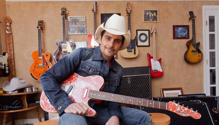 Brad Paisley joins mourners at Dickens memorial