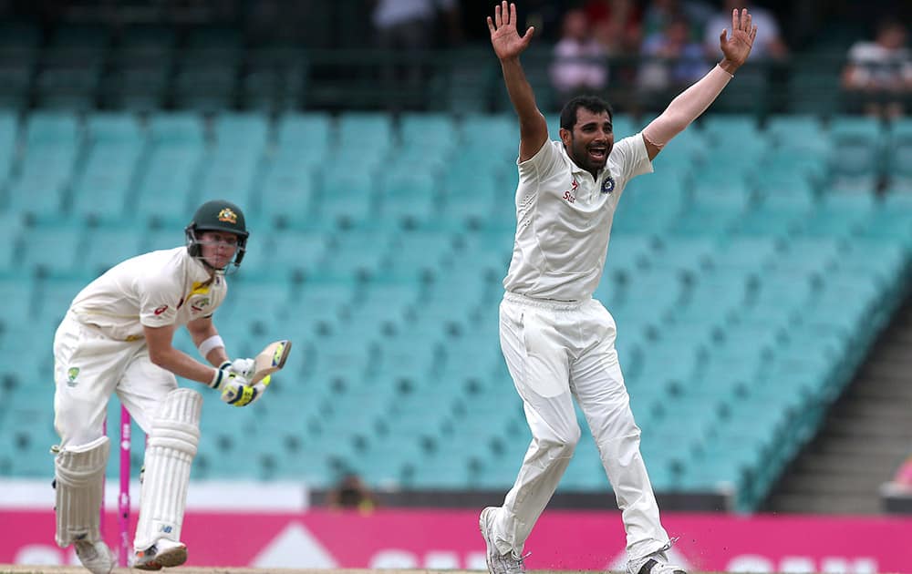 India's Mohammad Shami, appeals for a LBW decision and is granted it on Australia's Steve Smith, out for 71 runs on the fourth day of their cricket test match in Sydney.