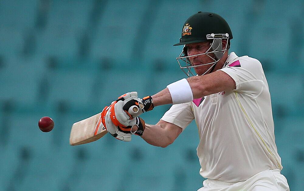 Australia's Brad Haddin drives the ball against India on the fourth day of their cricket test match in Sydney.