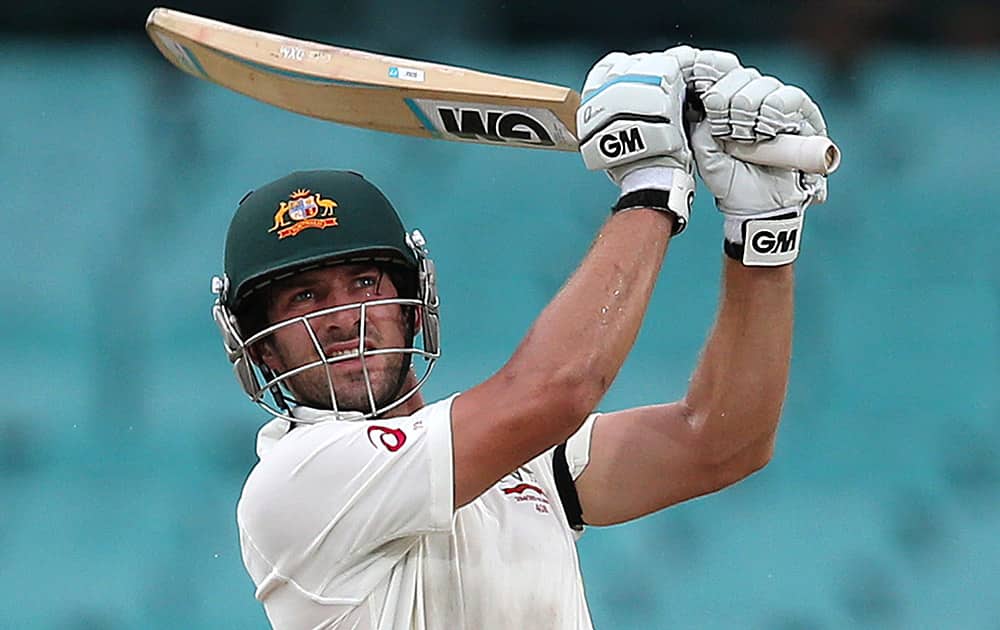 Australia's Joe Burns drives the ball against India on the fourth day of their cricket test match in Sydney.