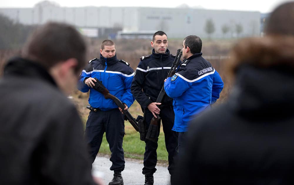 Gendarmes block the access to Dammartin-en-Goele, northeast of Paris. French security forces swarmed the small industrial town northeast of Paris Friday in an operation to capture a pair of heavily armed suspects in the deadly storming of a satirical newspaper.