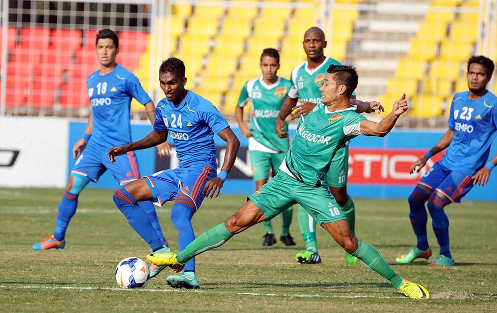 Dempo Sports Club and Salgaocar Sports Club players in action in the first semifinals of the Federation Cup Football Tournament at Nehru Stadium, Fatorda in Goa.