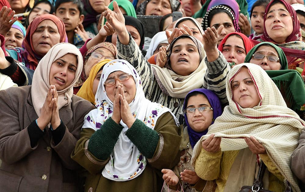 Devotees pray as they have a glimpse of a holy relic of Prophet Muhammad during the Eid Milad-un-Nabi at Hazratbal shrine in Srinagar.