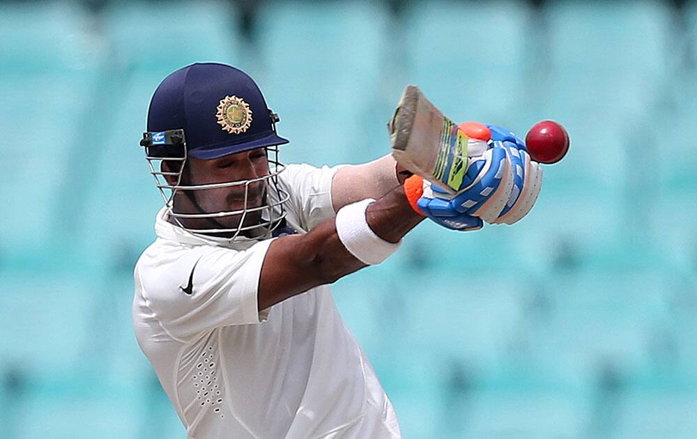 Lokesh Rahul hooks Australia's Ryan Harris on the fifth day of their cricket test match in Sydney,