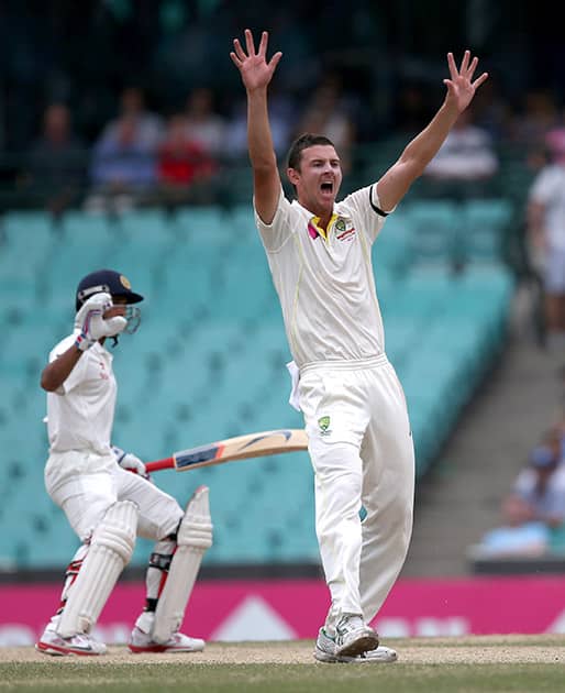 Australia's Josh Hazelwood, appeals to the umpire for a LBW decision on India's Ajinkya Rahane, on the fifth day of their cricket test match in Sydney.