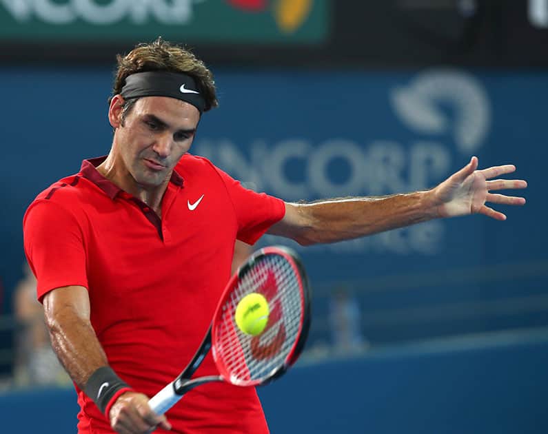 Roger Federer of Switzerland plays a shot in his semifinal match against Grigor Dimitrov of Bulgaria during the Brisbane International tennis tournament in Brisbane, Australia.