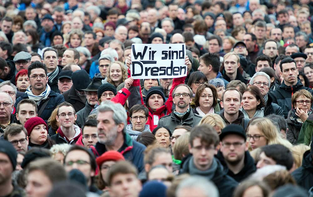 Tens of thousands participate in a demonstration against racism and for an open society in Dresden, eastern Germany.