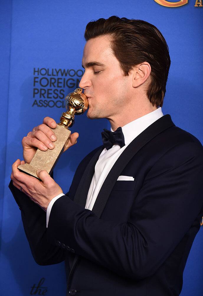 Matt Bomer poses in the press room with the award for best supporting actor in a series, miniseries or television movie for 