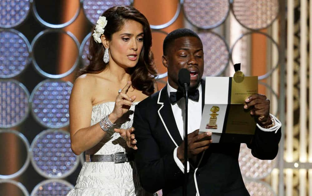 Salma Hayek, left, and Kevin Hart present an award at the 72nd Annual Golden Globe Awards.