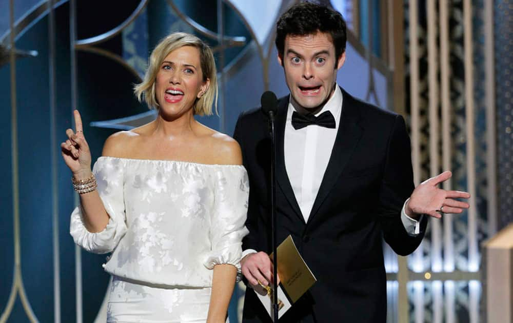 Kristen Wiig, left, and Bill Hader present an award at the 72nd Annual Golden Globe Awards .