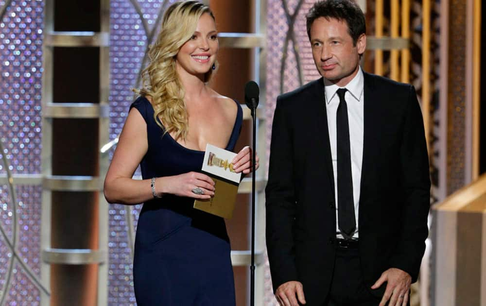 Katherine Heigl, left, and David Duchovny present an award at the 72nd Annual Golden Globe Awards.