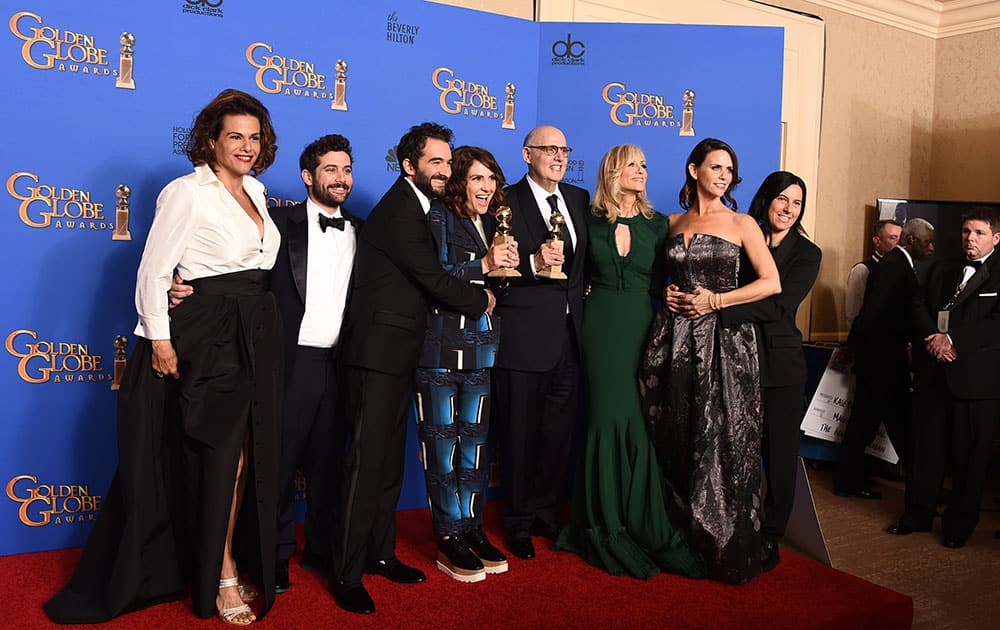 lexandra Billing, from left, Joe Lewis, Jay Duplass, Jill Soloway, Jeffrey Tambor, Judith Light, Amy Landecker and Andrea Sperling pose in the press room with the award for best actor in a television series - musical or comedy for 