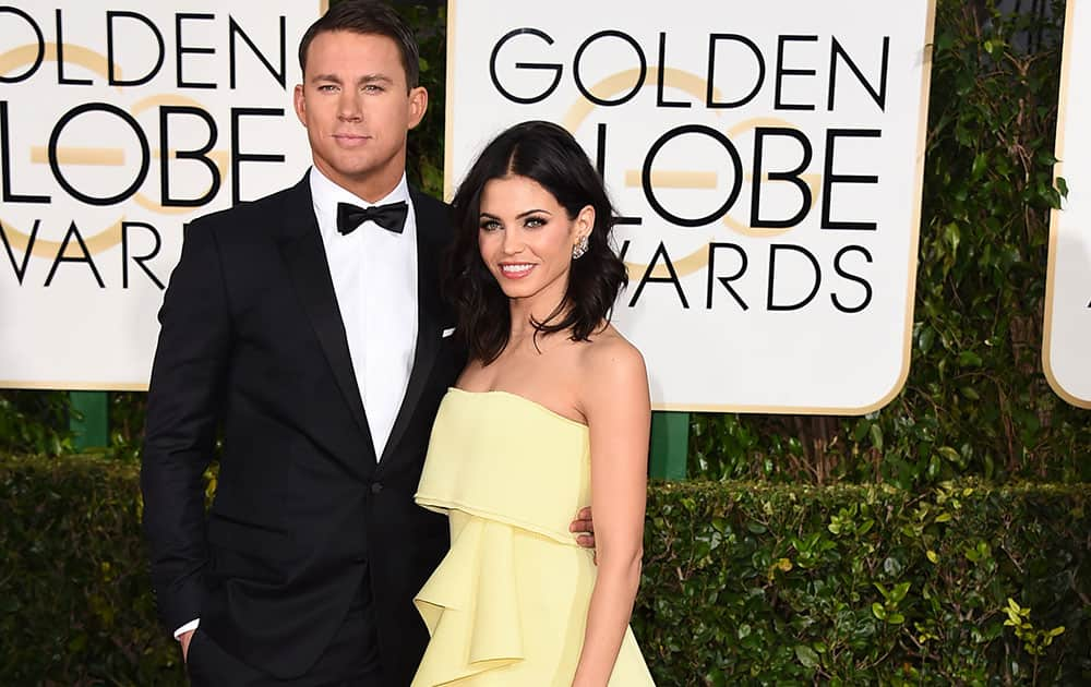 Channing Tatum, left, and Jenna Dewan Tatum arrive at the 72nd annual Golden Globe Awards.