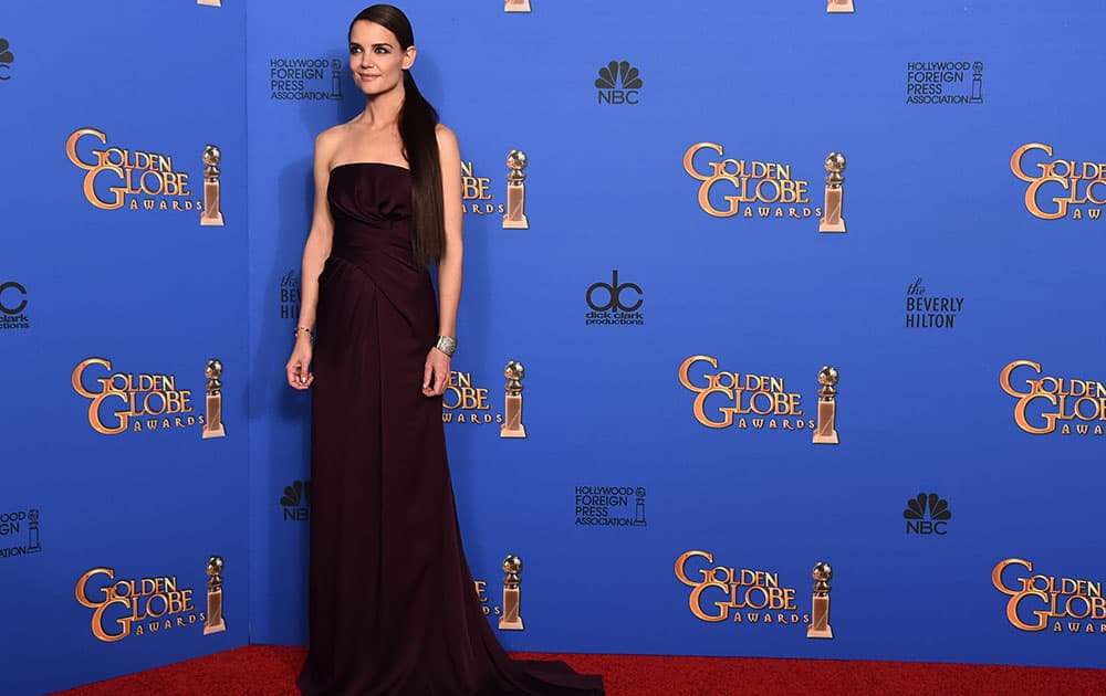 Katie Holmes poses in the press room at the 72nd annual Golden Globe Awards.