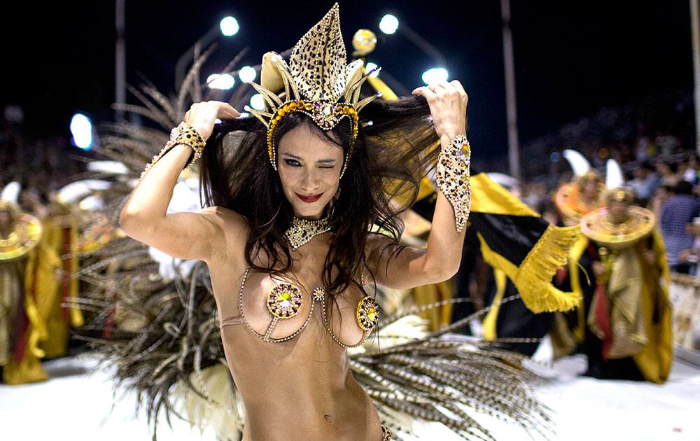 Evangelina Carrozo, a dancer with the Ara Yevi samba school, performs during a carnival parade in tribute to Pope Francis in Gualeguaychu, Argentina