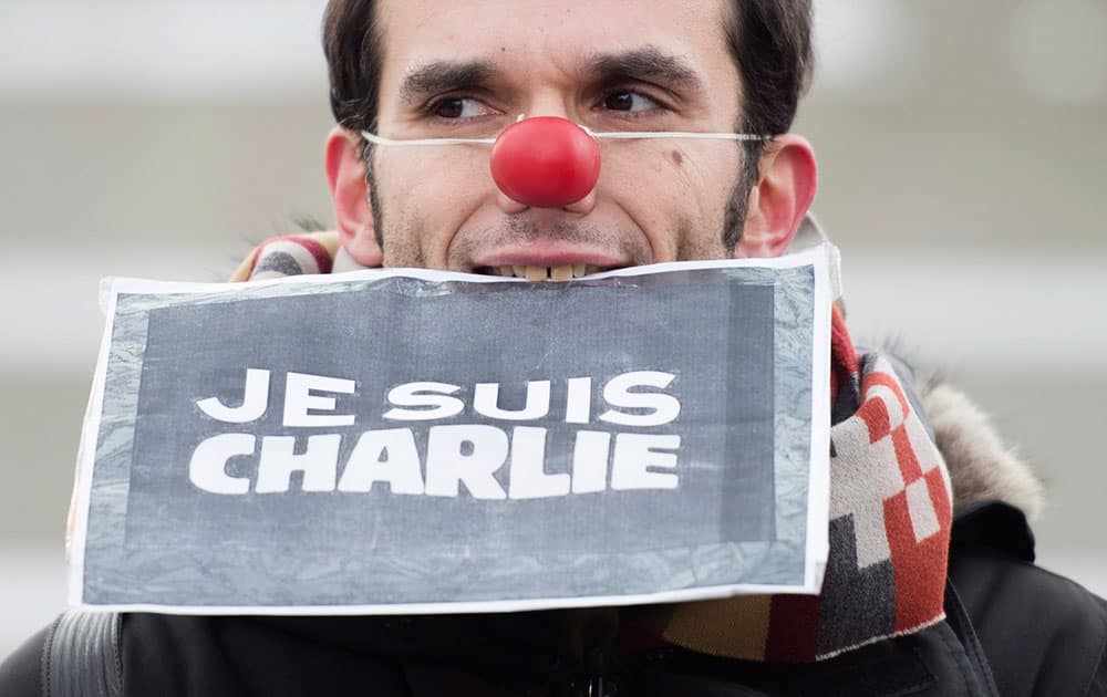A demonstrator wears a clown nose during a rally in support of free speech and to remember the victims of the recent terrorist attacks in France.