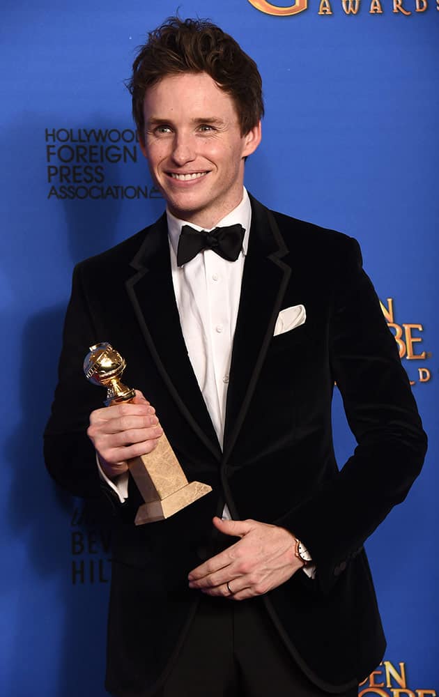 Eddie Redmayne poses in the press room with the award for best actor in a motion picture - drama for “The Theory of Everything” at the 72nd annual Golden Globe Awards.