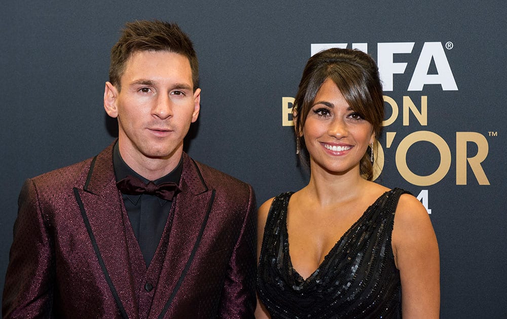Lionel Messi of Argentina and his wife arrive on the red carpet prior to the FIFA Ballon d'Or 2014 gala held at the Kongresshaus in Zurich, Switzerland.