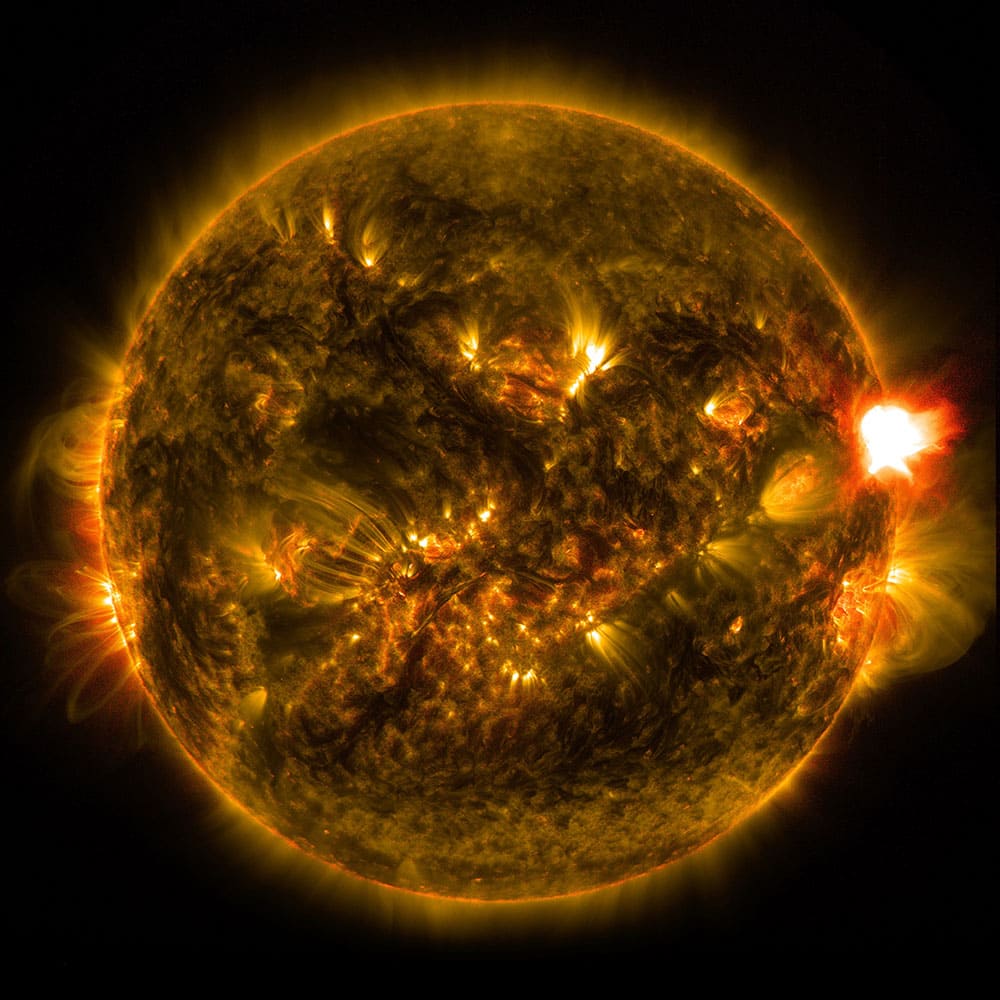 This photo provided by NASA shows the first notable solar flare of the year, as observed from NASA's Solar Dynamics Observatory. 