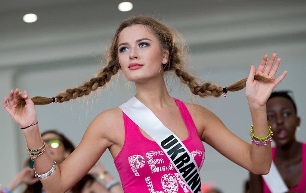 Miss Universe contestant Diana Harkusha, of Ukraine, participates in a Zumba class for the contestants, in Doral, Fla. 