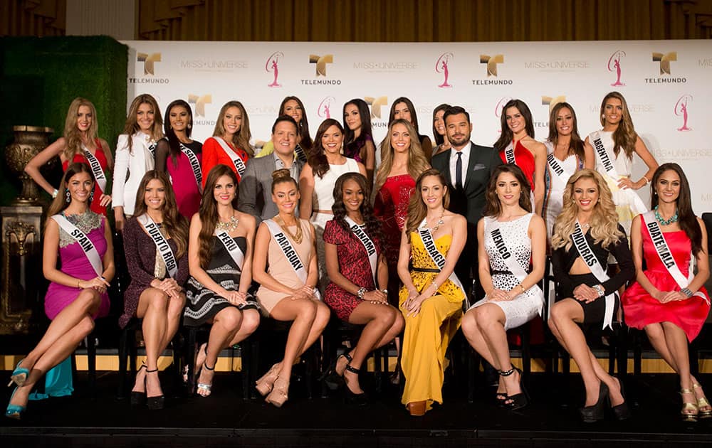 Miss Universe contestants from Latin America and Spain pose for a group photo during a news conference.