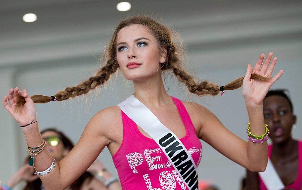 Miss Universe contestant Diana Harkusha, of Ukraine, participates in a Zumba class for the contestants, in Doral, Fla. The Miss Universe pageant will be held Jan. 25, in Miami.