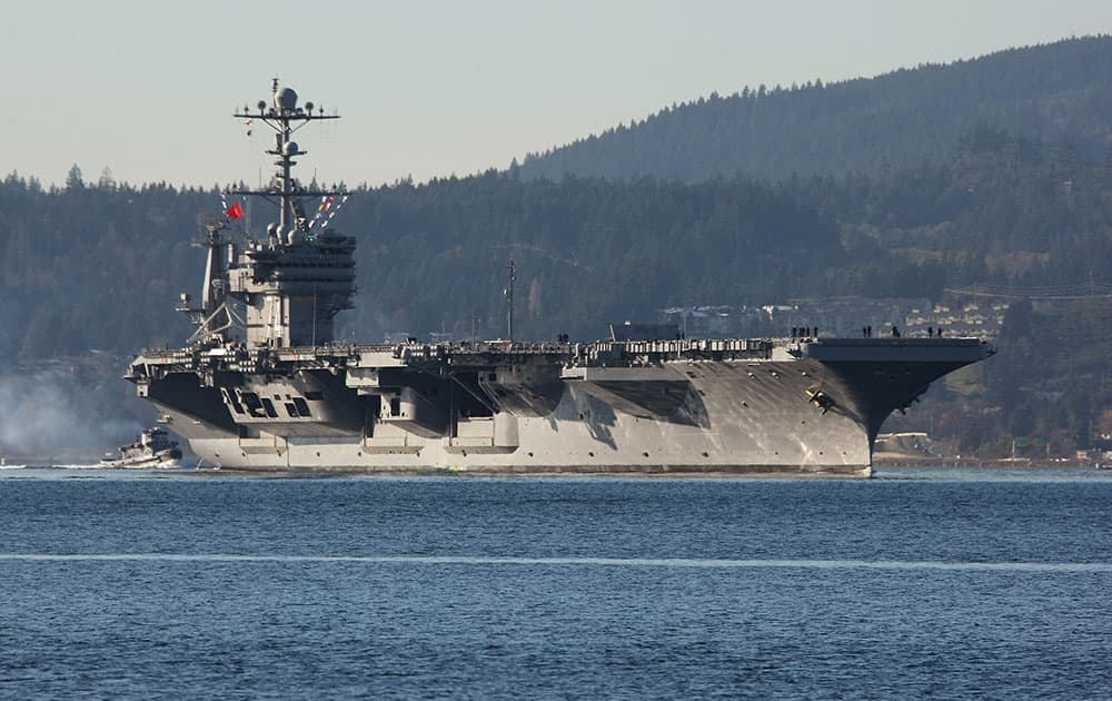 This photo, shows the aircraft carrier USS John Stennis near Bremerton, Wash., the ship sailed from Naval Base Kitsap in Bremerton, Wash., to Naval Magazine Indian Island, Wash., in order to take on ammunition before a training mission in the Pacific Ocean near San Diego, Calif.