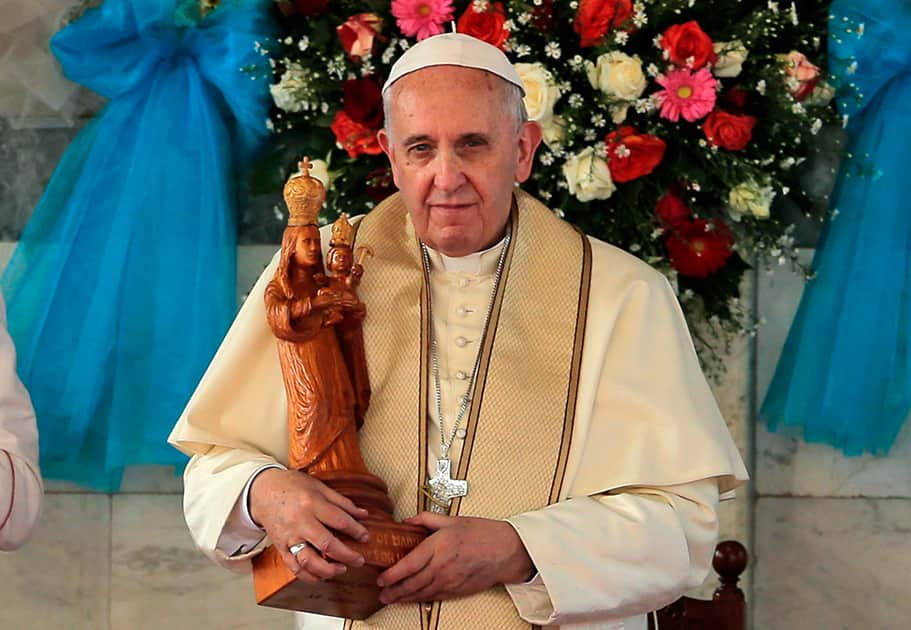 Pope Francis holds a statue of Our Lady of Madhu during his visit to the church in Madhu, Sri Lanka.