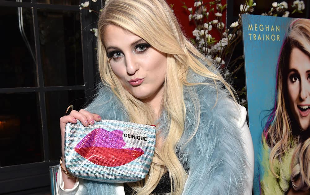 Meghan Trainor is seen with the Clinique bag she designed at her Epic Records album release party sponsored by Clinique at Warwick in Hollywood, Calif.