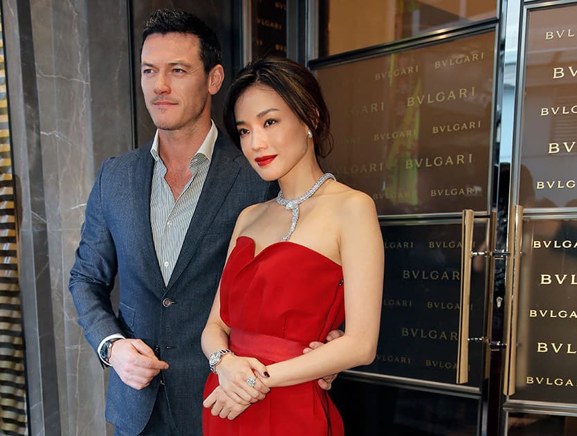 Taiwanese actress Shu Qi poses with British actor Luke Evans during a promotional event for Bulgari in Hong Kong.
