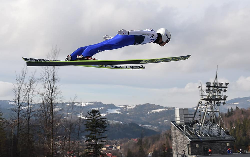 Japan's Daiki Ito soars through the air during his qualification jump at the 17th World Cup Ski Jumping competition, in Wisla, Poland.