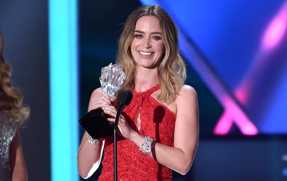 Emily Blunt accepts the best actress in an action movie award for 'Edge of Tomorrow' at the 20th annual Critics' Choice Movie Awards at the Hollywood Palladium, in Los Angeles.