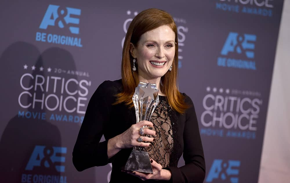 Julianne Moore, winner of the best actress award for 'Still Alice,' poses in the press room at the 20th annual Critics' Choice Movie Awards at the Hollywood Palladium, in Los Angeles.