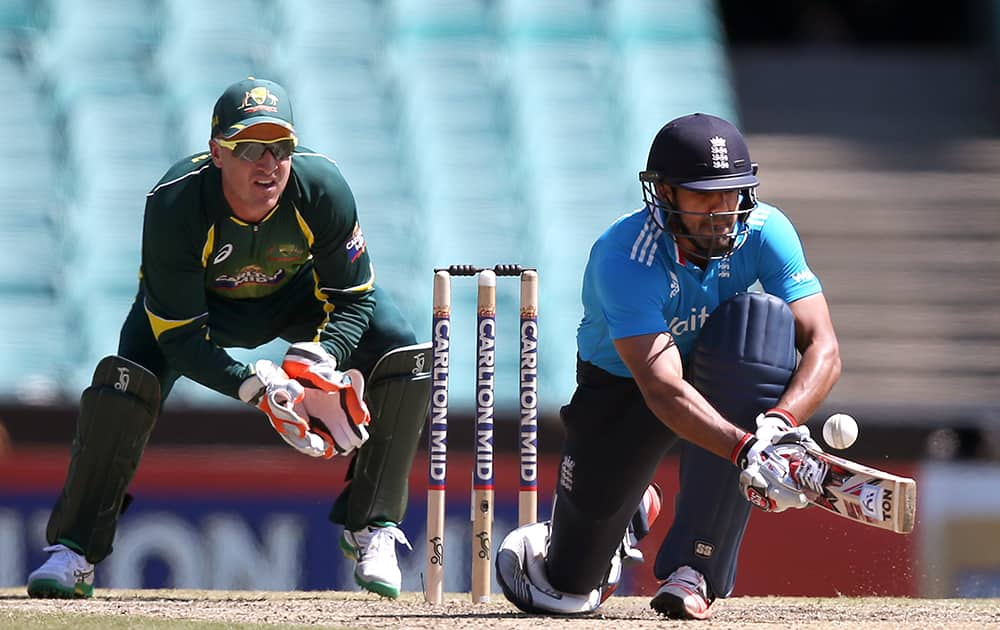 England's Ravi Bopara, sweeps the ball in front of Australia's Brad Haddin during their One Day International cricket match in Sydney.