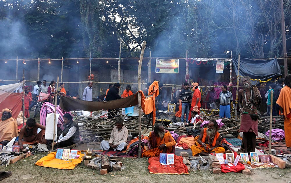 Pilgrims and sadhus, or Hindu holy men, set up their resting space at a transit camp on the way to Gangasagar, in Kolkata.