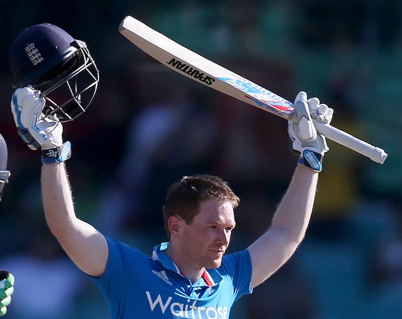 England's Eoin Morgan celebrates after making 100 runs against Australia during their One Day International cricket match in Sydney.