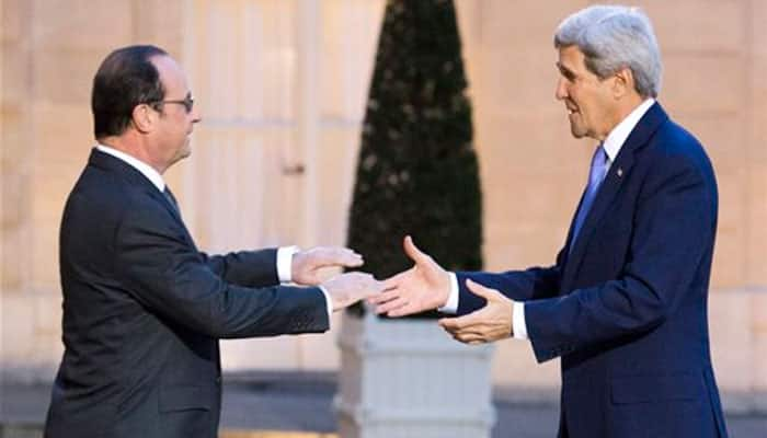 John Kerry hugs Hollande, says shares France`s pain