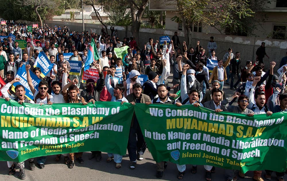Supporters of Pakistani religious group Jamaat-i-Islami protest caricatures published in French magazine Charlie Hebdo, in Karachi, Pakistan.