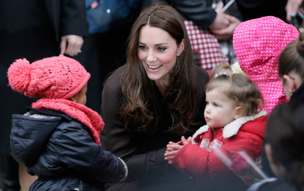 Kate, Duchess of Cambridge speaks to school children as she leaves an event organised by The Fostering Network to celebrate their work with young people, in London, England. The Duchess met social workers and care leavers to learn about the world of fostering.