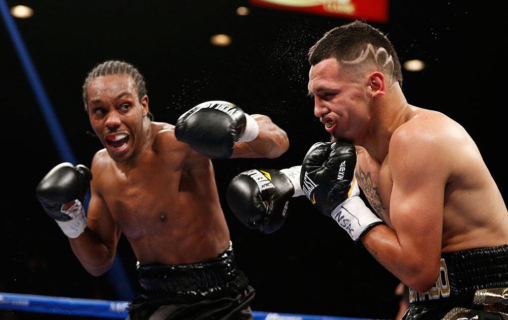 Amir Imam hits Fidel Maldonado Jr. during their boxing bout in Las Vegas. 