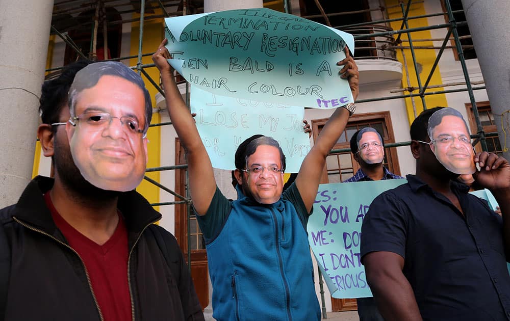 Employees of various Information Technology/ Information Technology Enabled Services companies wear masks of the Indian multinational Tata Consultancy Services (TCS) Chief Executive Officer Natarajan Chandrasekaran during a protest in Bangalore, India.