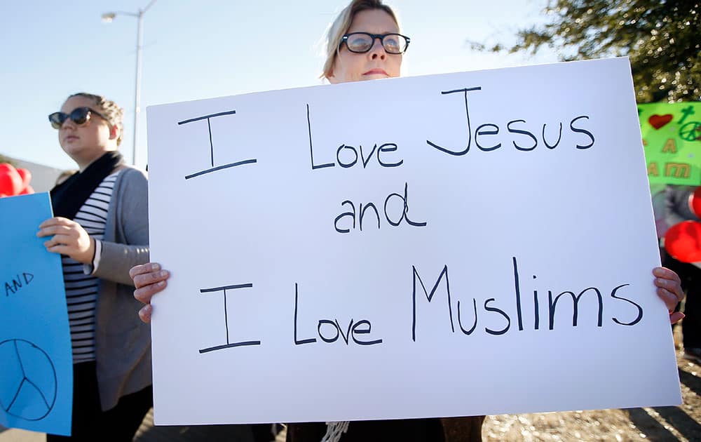 Susan Gist of Garland, Texas, holds a sign as she joins supporters outside the Curtis Culwell Center where a muslim conference against terror and hate was scheduled, in Garland, Texas.