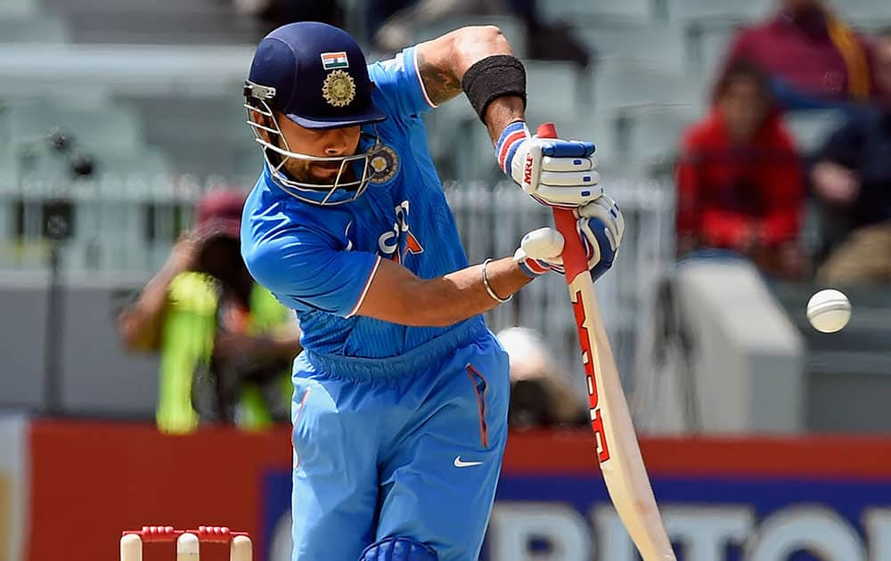 India's Virat Kohli hits a shot against Australia during their one-day international cricket match in Melbourne.