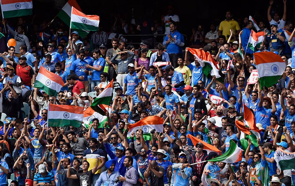 Indian fans cheer on their team while playing against Australia during their one-day international cricket match in Melbourne.