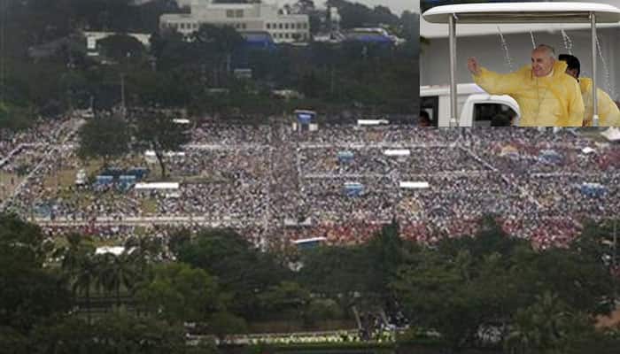 Pope attracts world-record crowd in wet Philippines