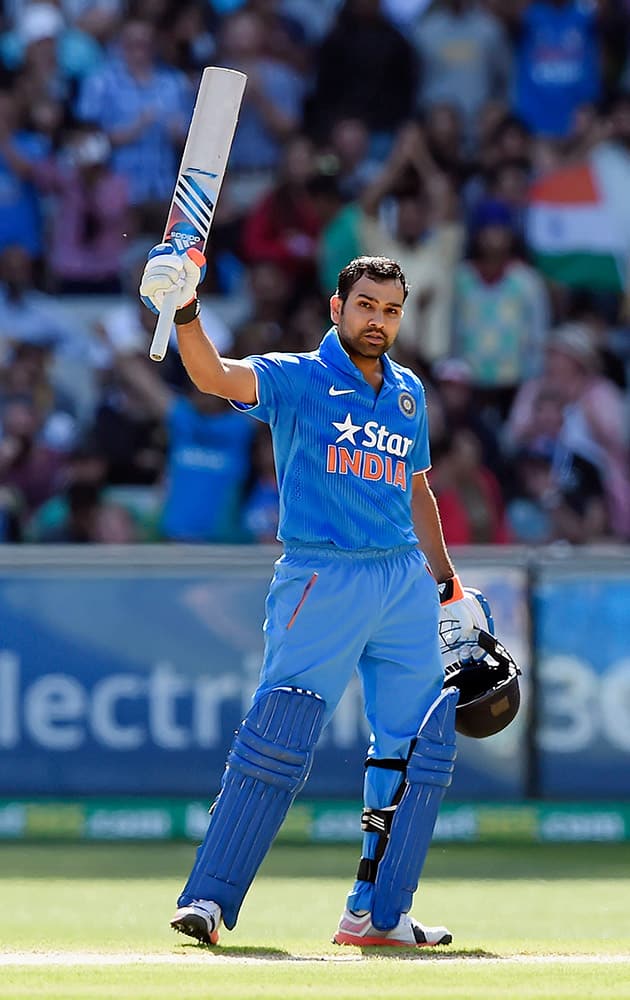 India's Rohit Sharma celebrates making 100 runs against Australia during their One Day International cricket match in Melbourne, Sunday.