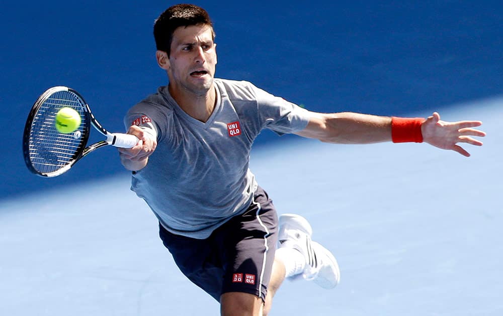 Novak Djokovic of Serbia returns a forehand shot during a training session at the Australian Open tennis championship in Melbourne, Australia, Sunday.