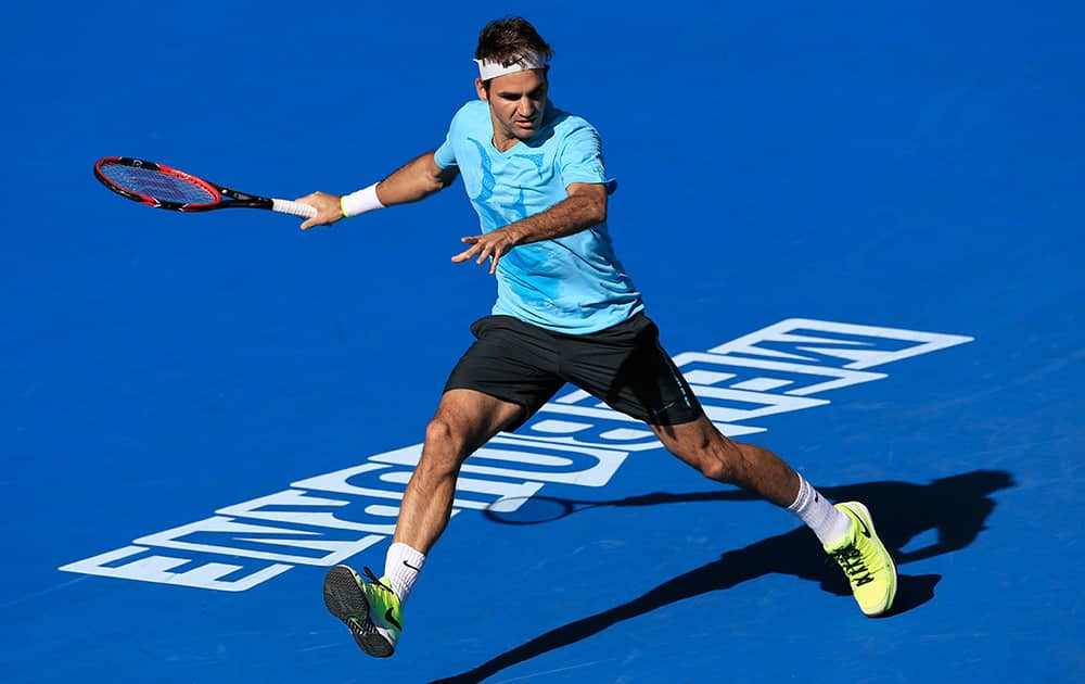 Roger Federer of Switzerland chases down the ball during a training session at the Australian Open tennis championship in Melbourne, Australia, Sunday.